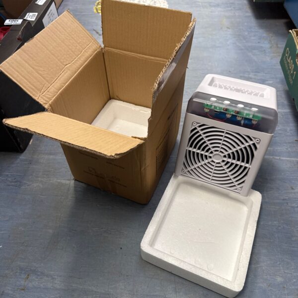 Personal desktop cooler in original packaging, showing a small USB fan.