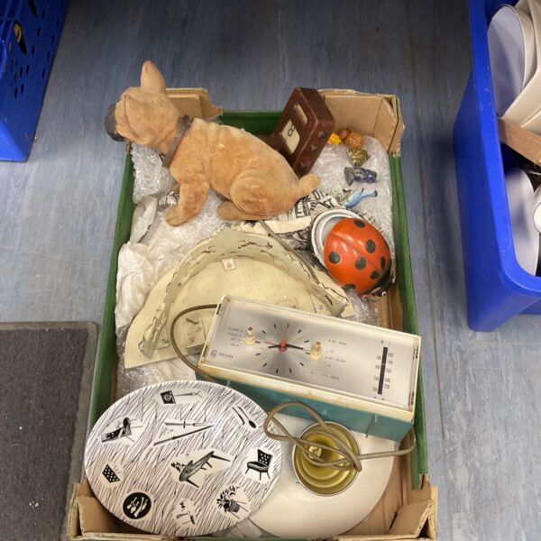 Vintage Phillips clock amongst house clearance items.