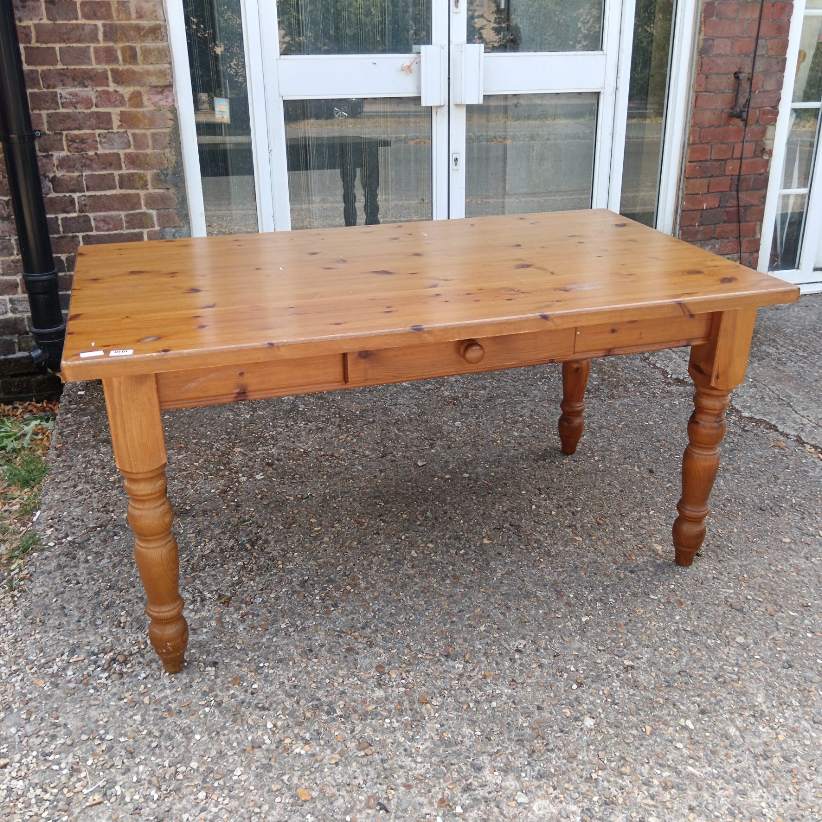 Large pine kitchen table with a single drawer, farmhouse style.