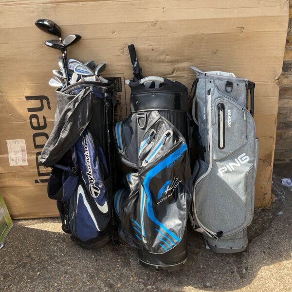 Ping golf bag filled with clubs and golf accessories.