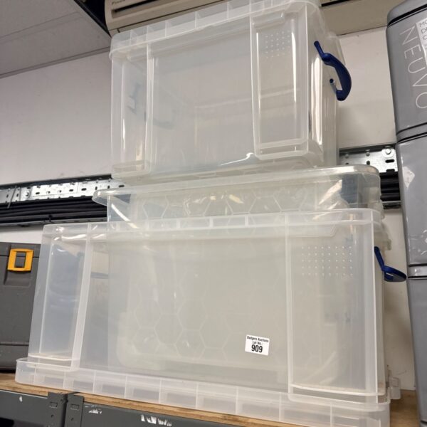 Assorted size clear plastic storage boxes with lids for home organization.
