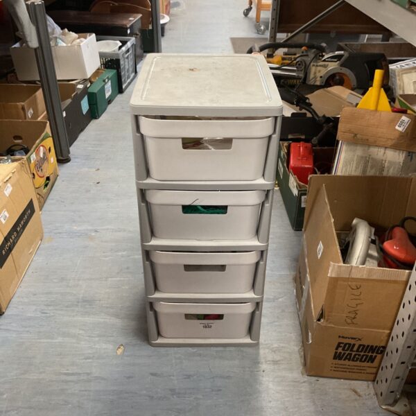 White plastic storage tower with four drawers, ideal for home organisation.