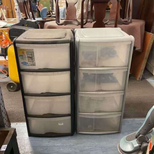 Grey plastic storage tower with clear shelves for organisation.