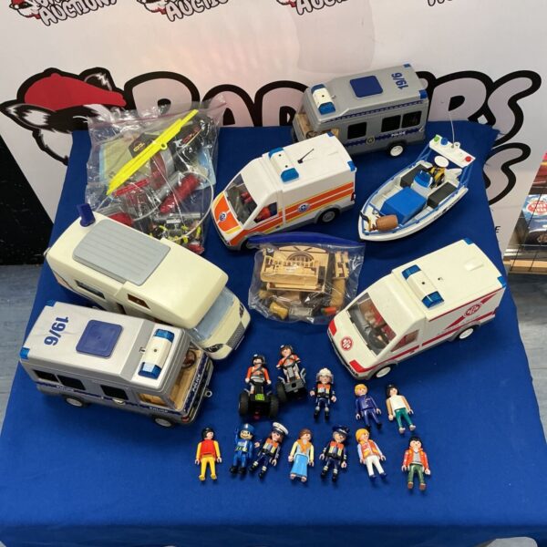Vintage Playmobil collection featuring a police van and ambulance.
