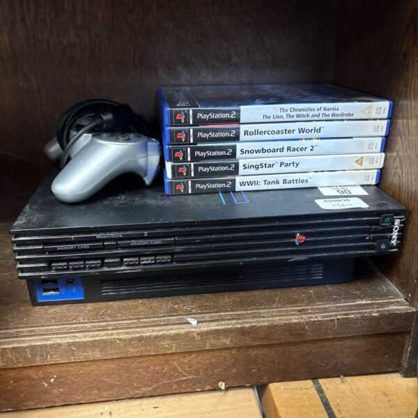Sony PlayStation 2 console with games and controller for sale.