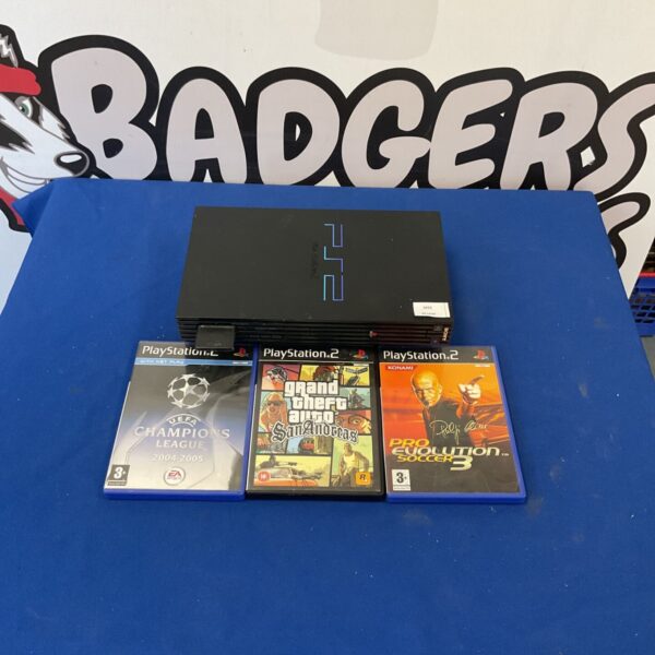 Black PlayStation 2 console with games including Pro Evolution Soccer.