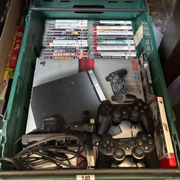 PlayStation 3 Super Slim console with games and accessories.