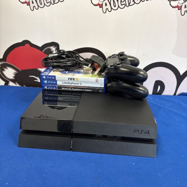 Sony PlayStation 4 console with games and controllers displayed.