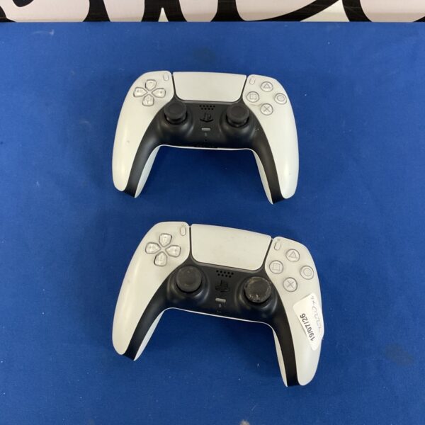 Two white and black Playstation 5 DualSense controllers.