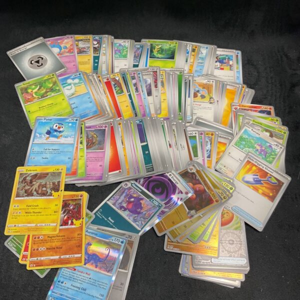 Pokemon card collection lot with various Pokemon designs.