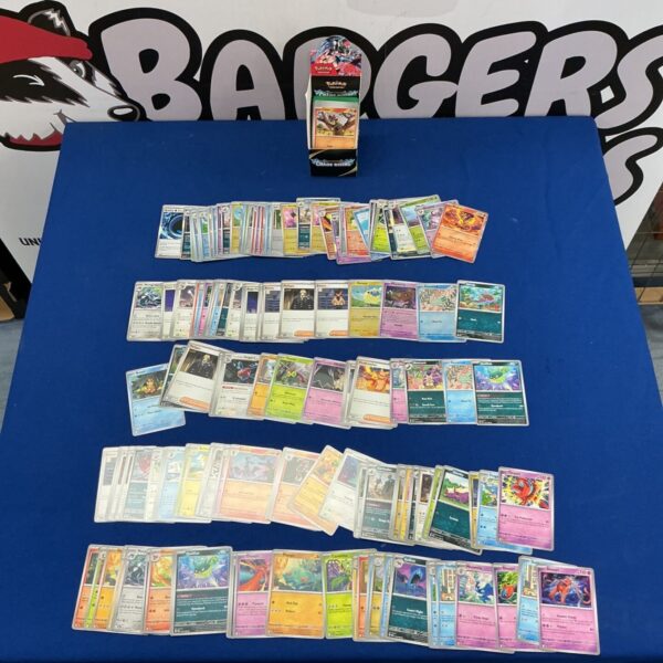 Pokémon trading card collection with display stand, featuring Mega Evolution cards.