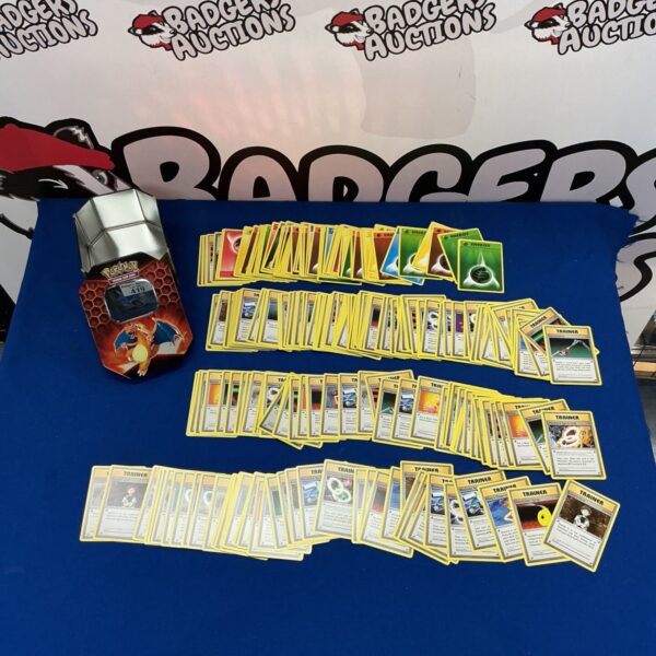 Pokémon Trainer cards and Energy cards in a collectible tin.