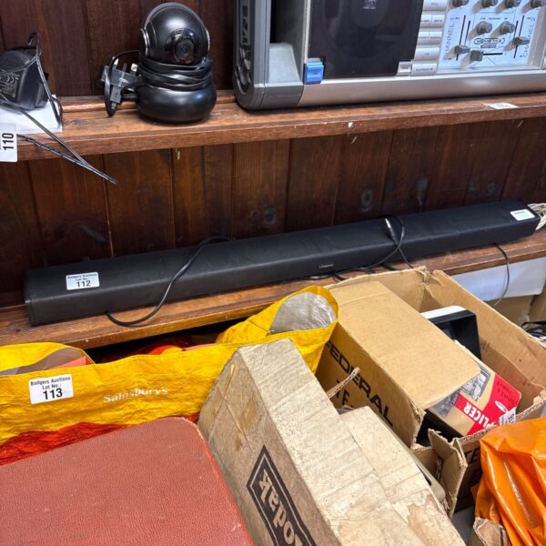 Polaroid TB301 soundbar with charger, vintage portable audio system.
