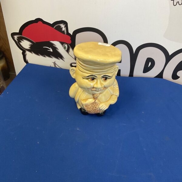Vintage porcelain biscuit jar with a gentleman design.