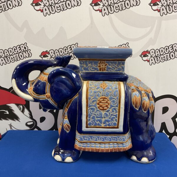 Vibrant glazed porcelain Indian elephant pot stand for plants.