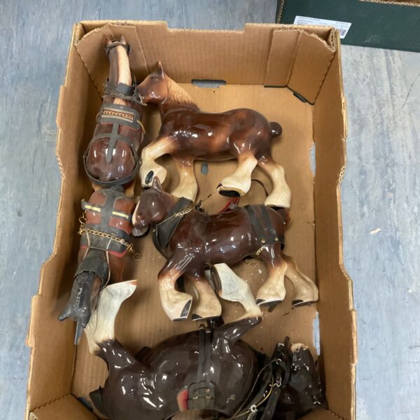 Lot of vintage porcelain shire horse figurines for collectors.