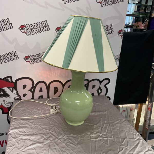 Vintage green porcelain table lamp with cream shade.