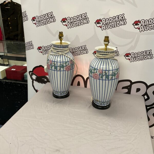 Pair of vintage porcelain table lamps with floral design.