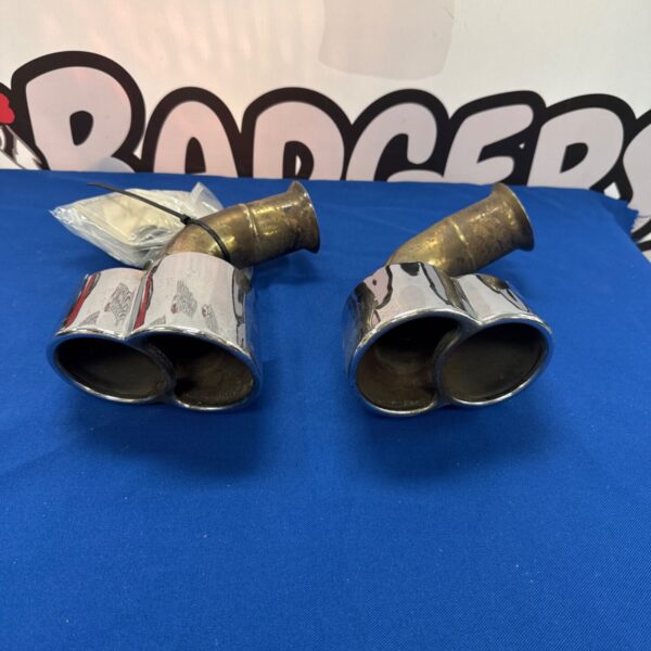 Porsche 996 exhaust tailpipes with gaskets, used condition.