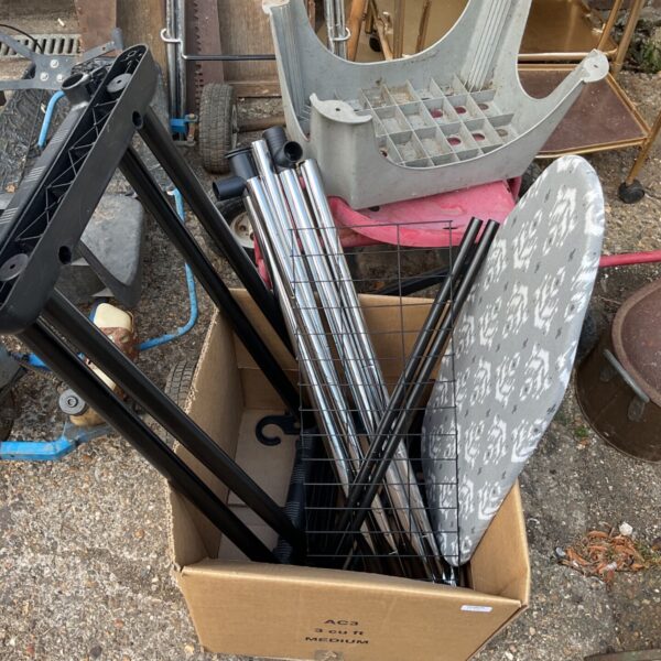 Portable clothes rail and camping ironing board in used condition.