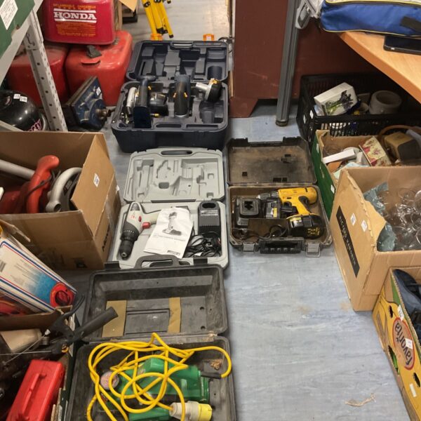 Power tool collection including Dewalt, Hitachi, and cordless drills.