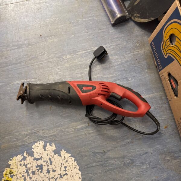 Red Powerbase Xtreme electric reciprocating saw for DIY projects.
