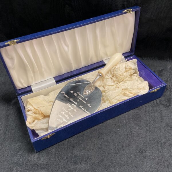 Silver plated presentation trowel commemorating Rycote Court topping out in 1986.