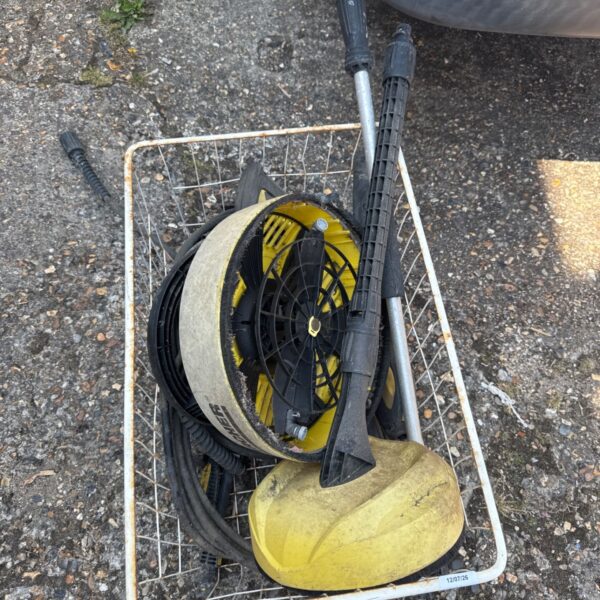 Karcher pressure washer attachments in a wire basket.