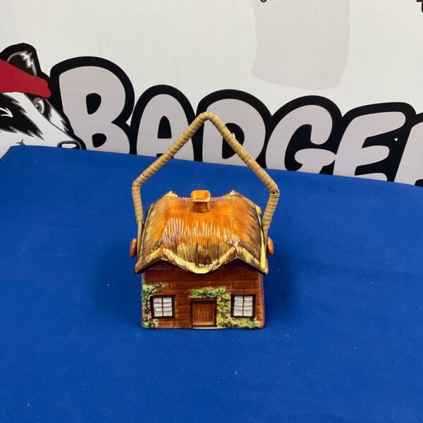 Vintage Price of Kensington biscuit jar with thatched roof.