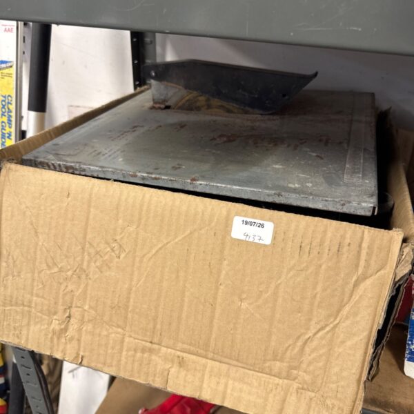 QEP QP34UK wet tile saw in cardboard box, showing label.