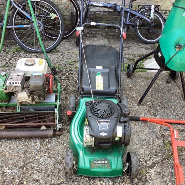 Vintage Qualcast 450 E Series petrol lawn mower in used condition.