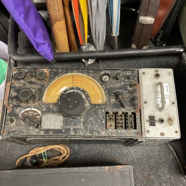 Front view of vintage R1155 receiver with dials and controls.