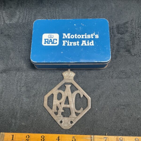 Vintage RAC car badge and empty first aid tin for collectors.