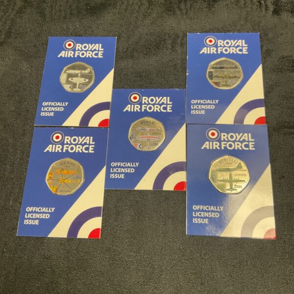 Royal Air Force commemorative coins featuring colourful aircraft designs.