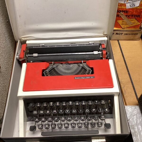Vintage Reader's Digest 2000 typewriter in black and cream.