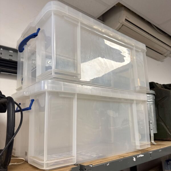 Clear 64L Really Useful Storage Box with blue lid.