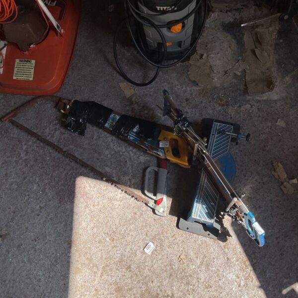 Ryobi reciprocating saw with cord and attachments.