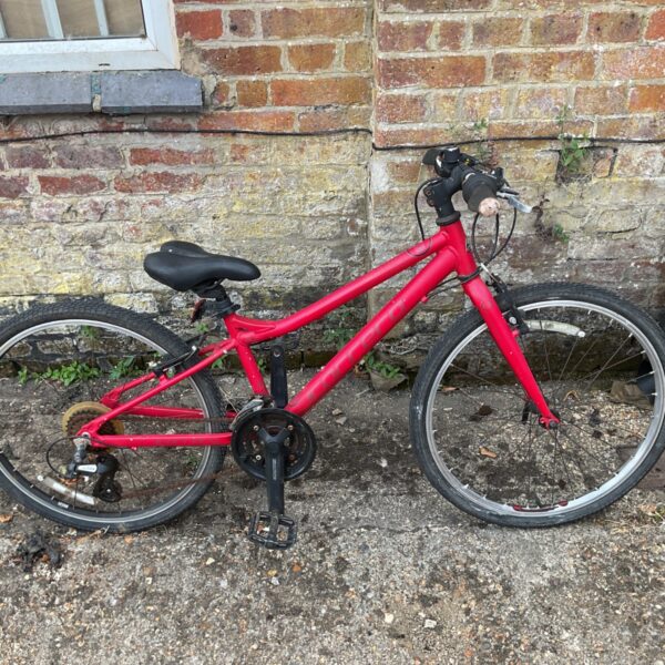 Red Carrera boys bike, a used kids mountain bicycle.