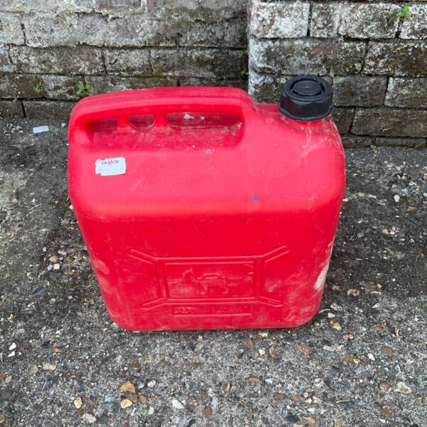 Red plastic fuel canister for petrol and diesel storage.