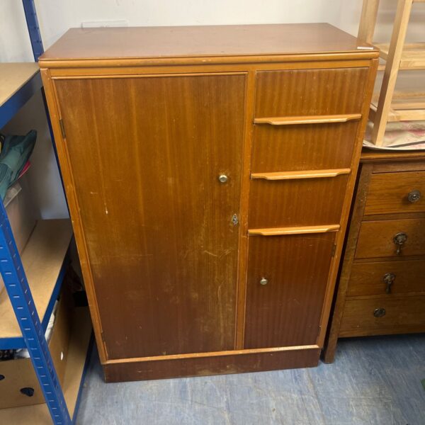 Vintage 1950s Remploy compactum wardrobe in light wood finish.