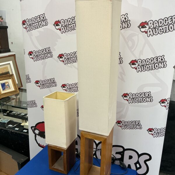 Pair of retro table lamps with wooden bases and off-white shades.