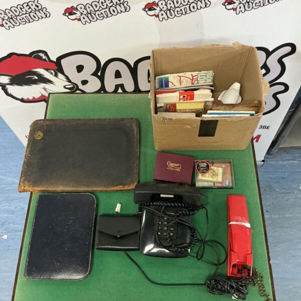 Mixed lot of vintage telephones, maps and playing cards.