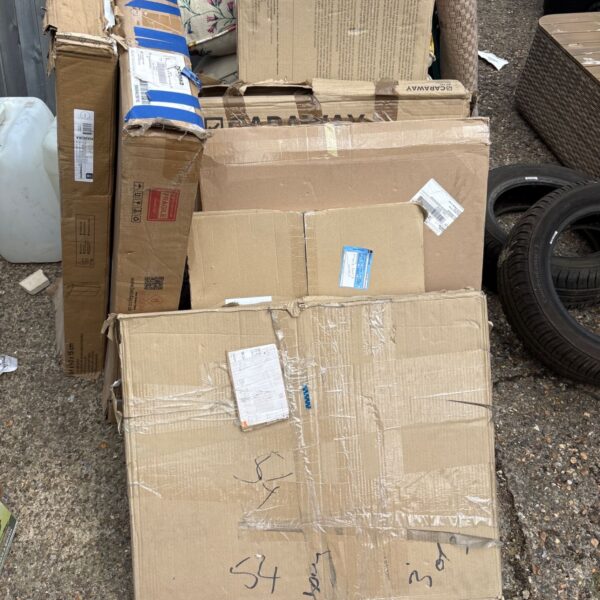 Stack of returned concealed cabinet boxes in a job lot.