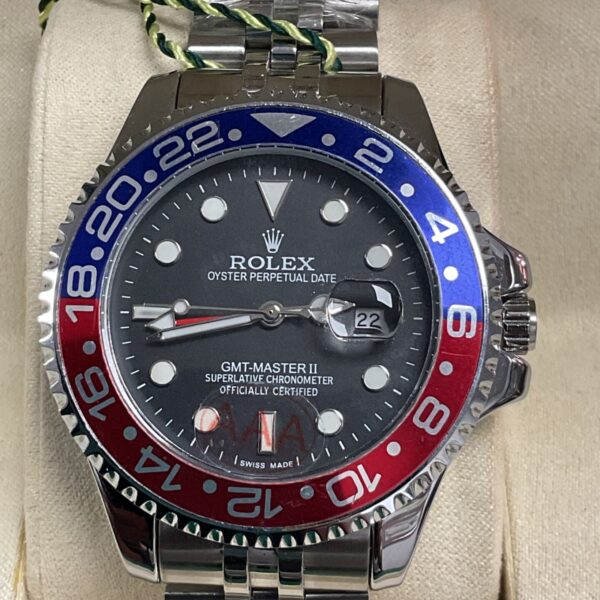 Rolex style GMT Master II watch with blue and red bezel.