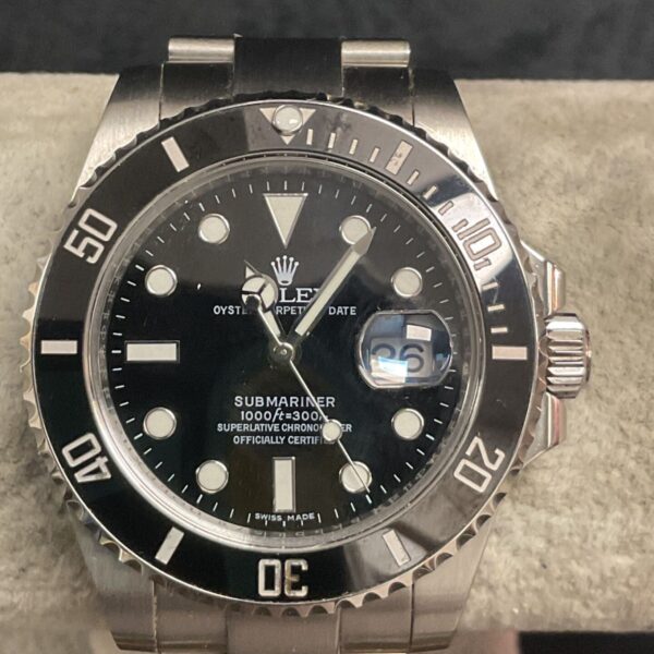 Rolex Submariner style automatic wristwatch with black dial.