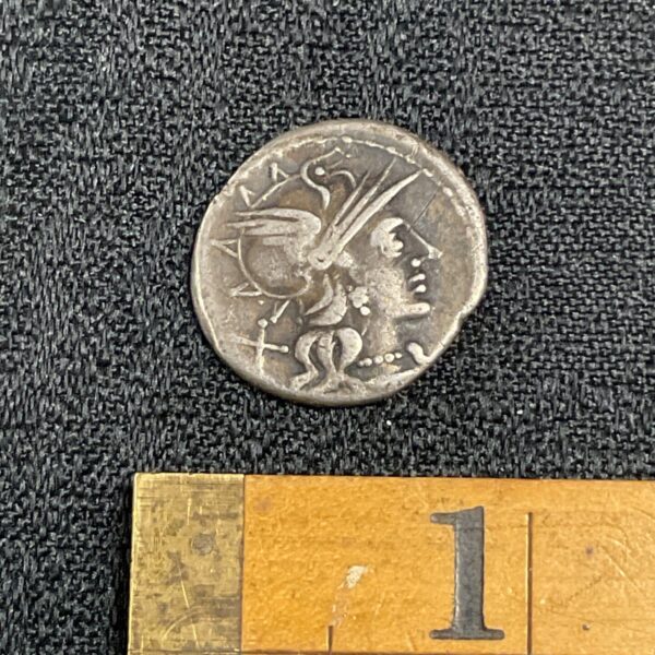 Silver Roman Republic dinarius with helmeted head of Roma.