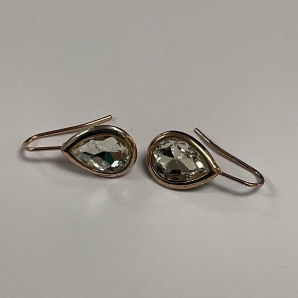 Rose gold teardrop earrings with clear crystal pendants.