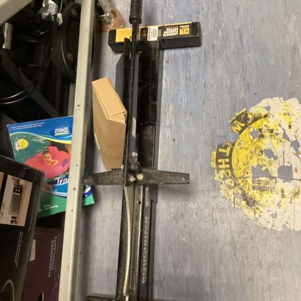 Roughneck laminate flooring cutter with Zoggs swimming aid nearby.