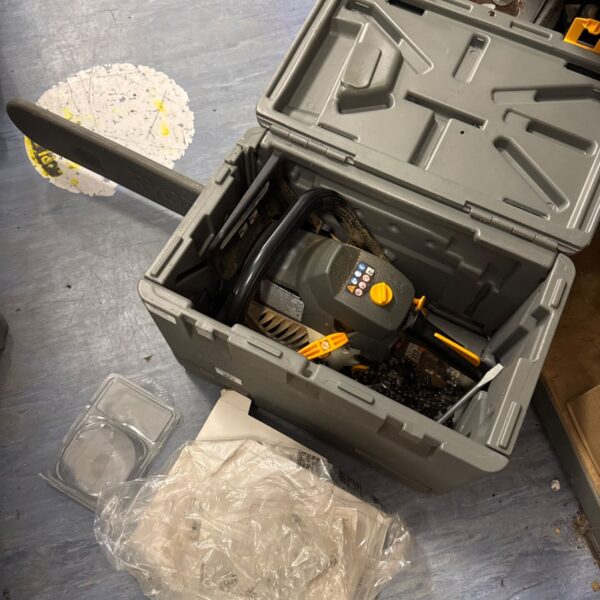Ryobi rcs-4046c petrol chainsaw in its original case, showing wear.