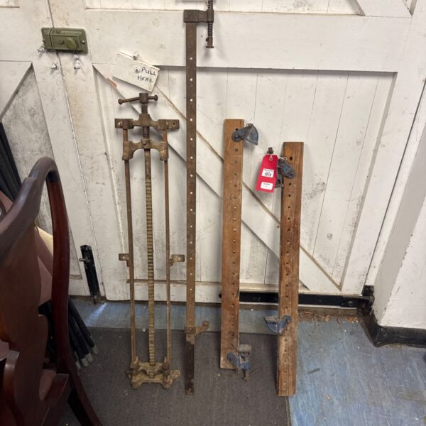 Vintage sash clamps and a smaller clamp for woodworking projects.